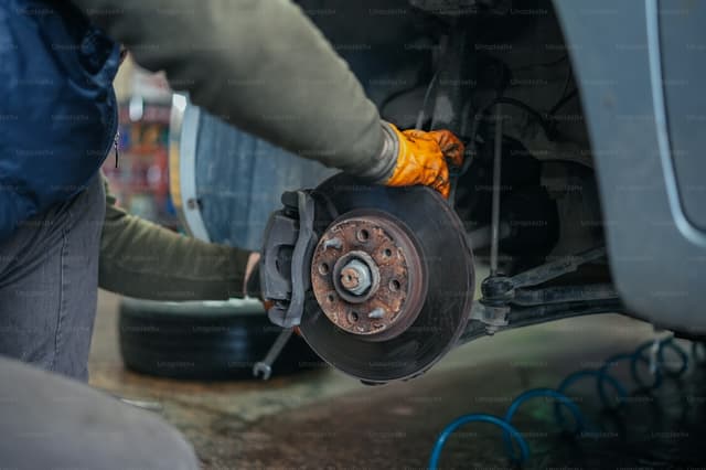 Brake disc and caliper exposed with the wheel removed