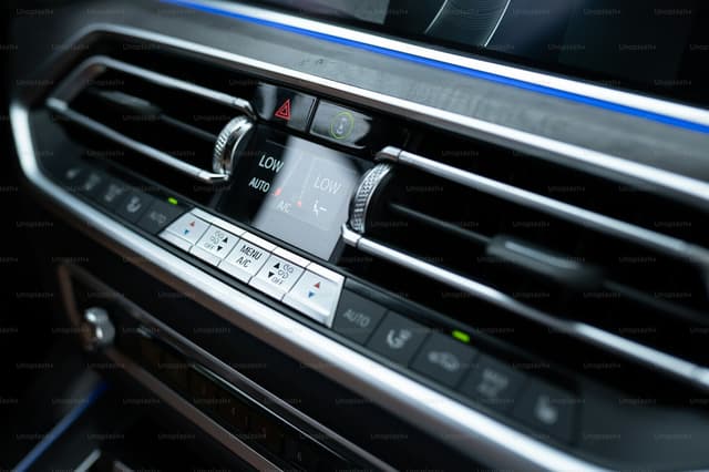 Car dashboard air conditioning vent and controls